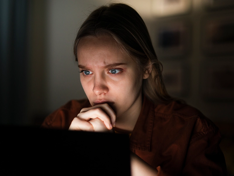 Woman analyzing dark web monitoring report